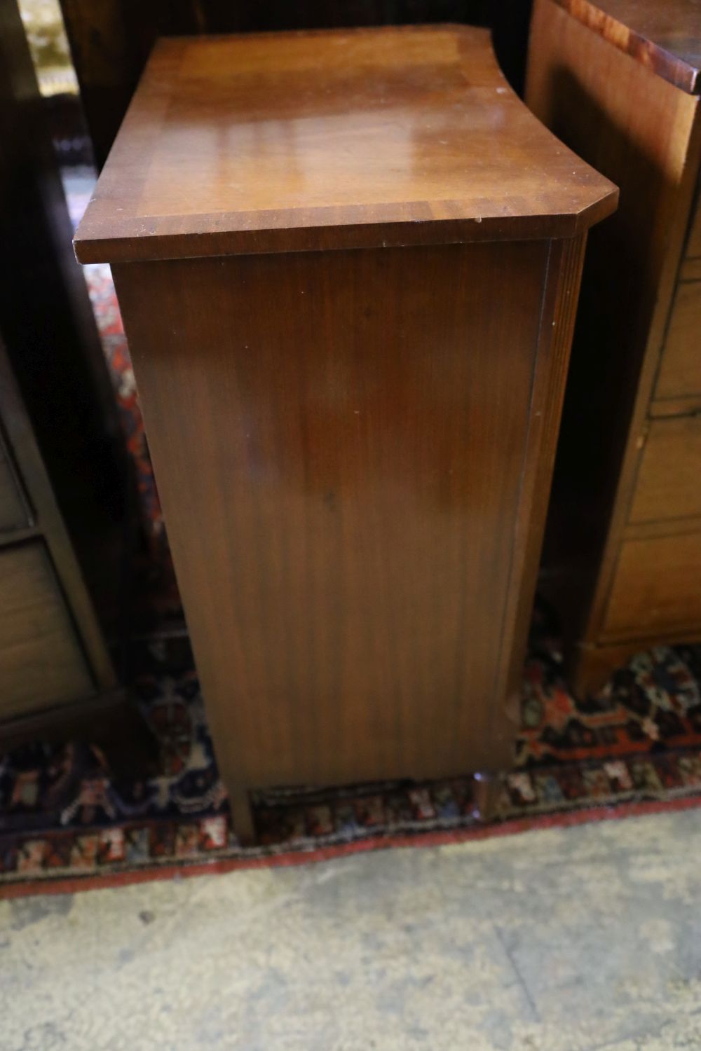 A mahogany concave side cabinet enclosed by tambour front, width 50cm, depth 34cm, height 72cm